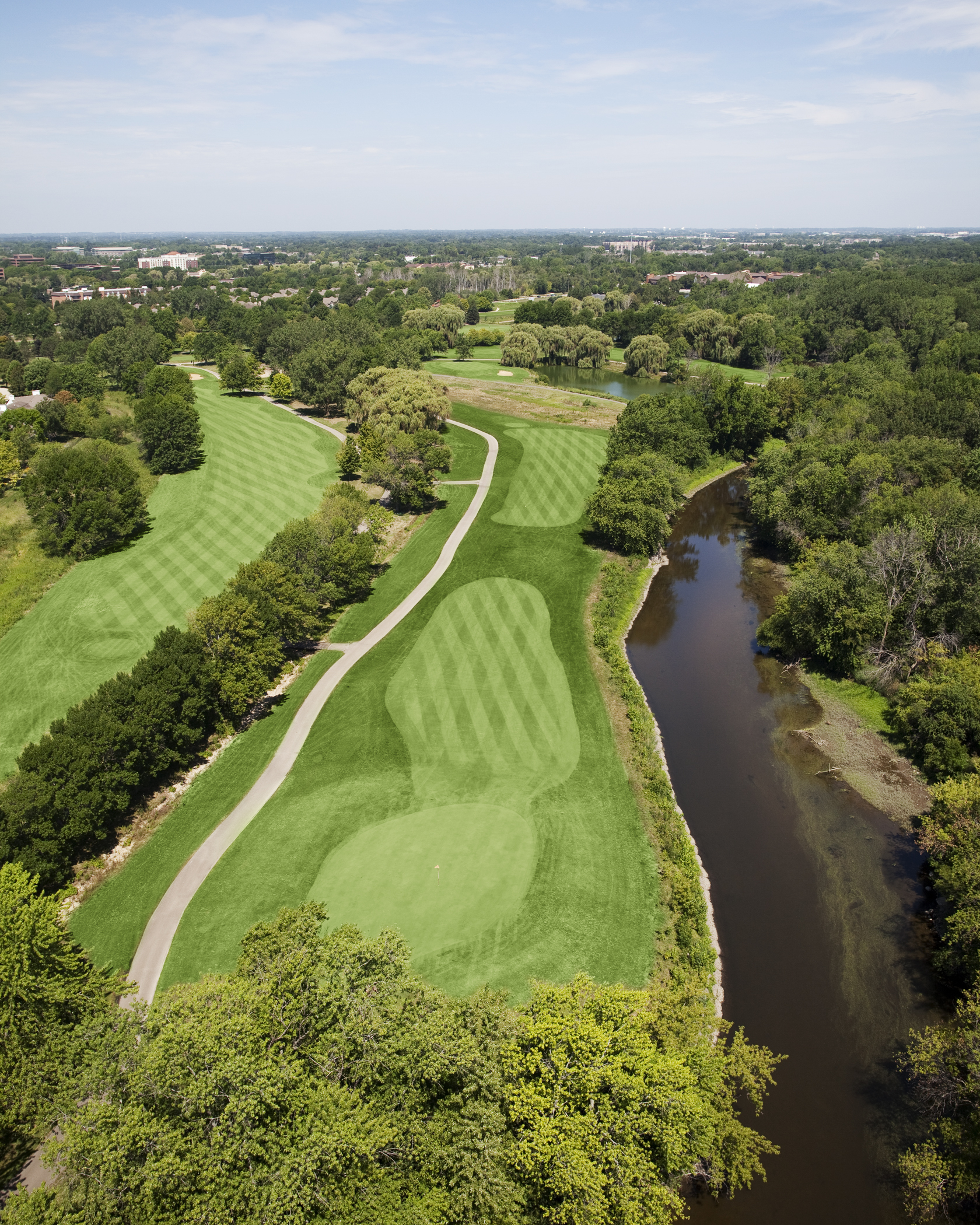 Image of golf ball on tee on grass.